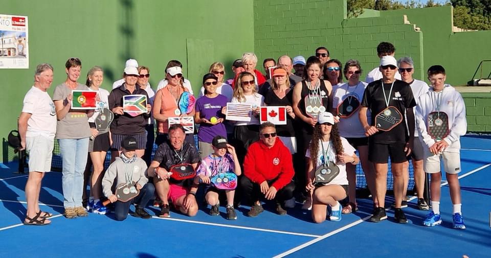TRAVEL4PICKLE players together on a pickleball court