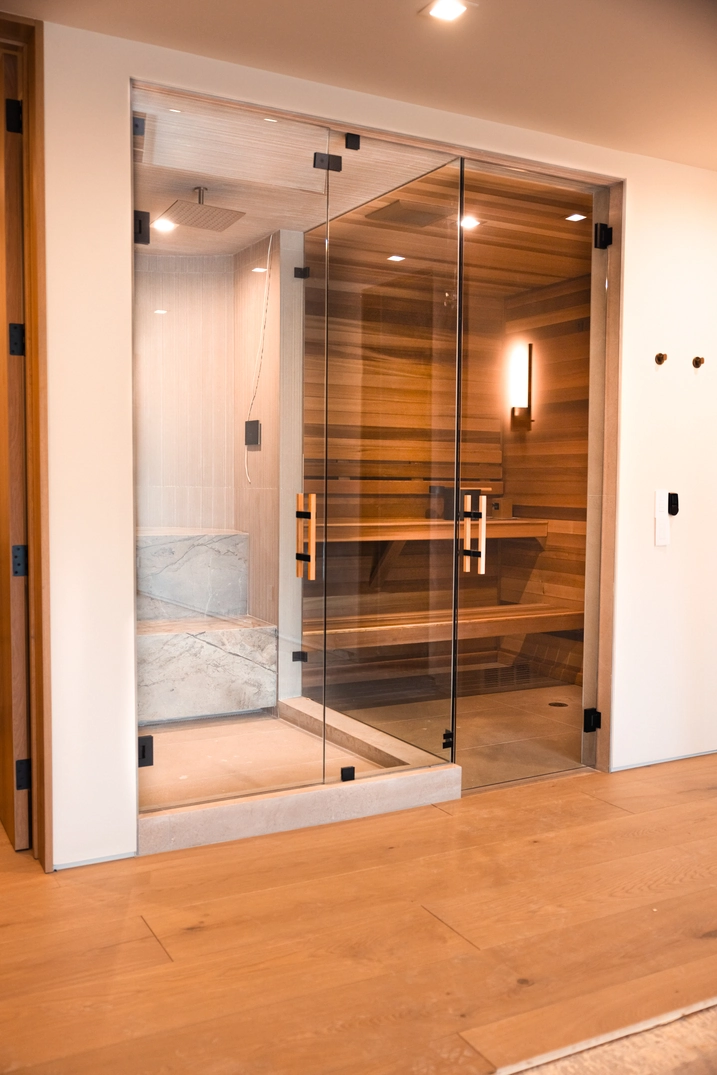 Warm cedar benches with concealed lighting inside the Custom Lehi sauna