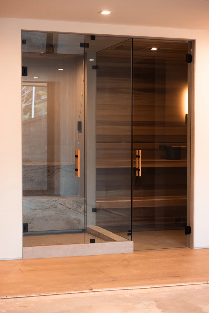 Glass-fronted cedar sauna integrated into the Deer Valley home