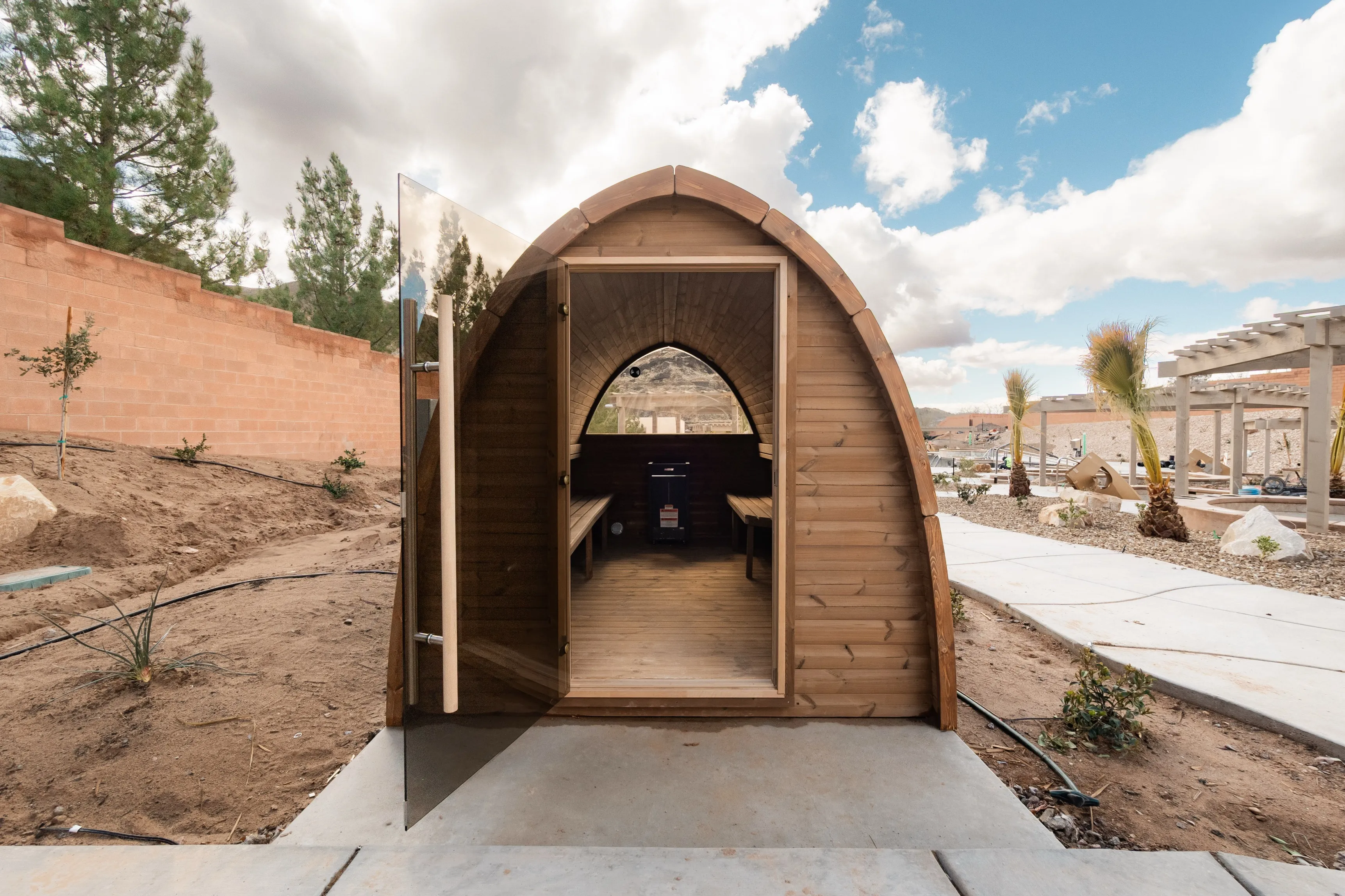 Open entrance to a cedar barrel sauna at Zion Canyon Hot Springs