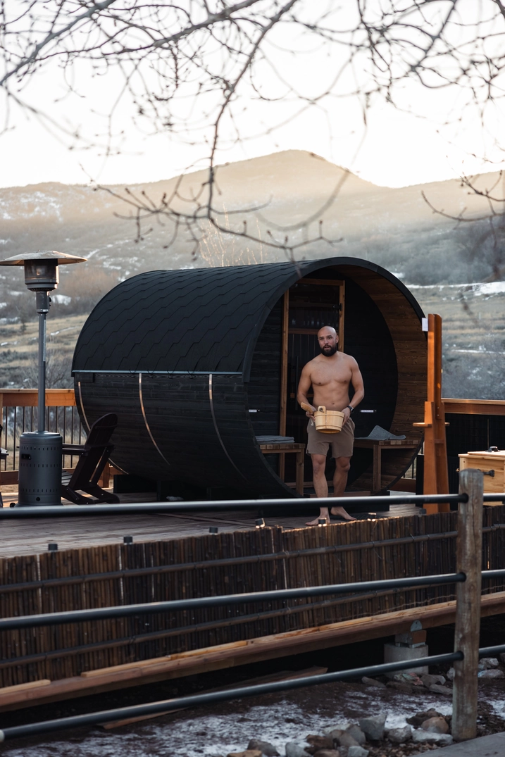 Guest stepping out of the Soldier Hollow barrel sauna