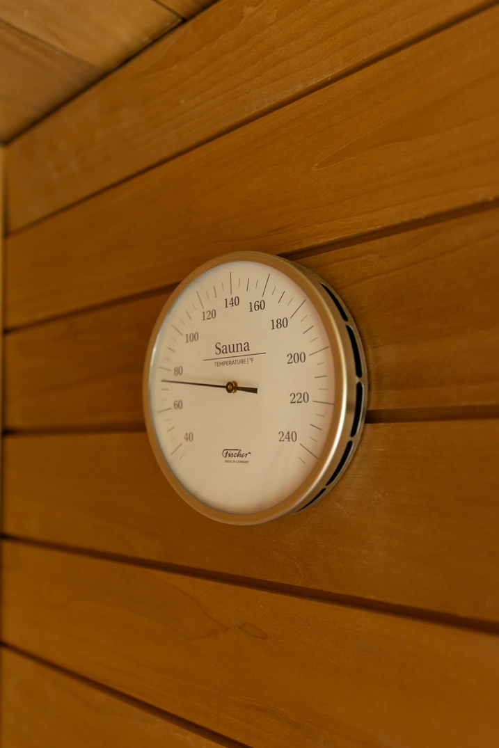 Sauna thermometer mounted on the cedar wall of the Custom Lehi sauna