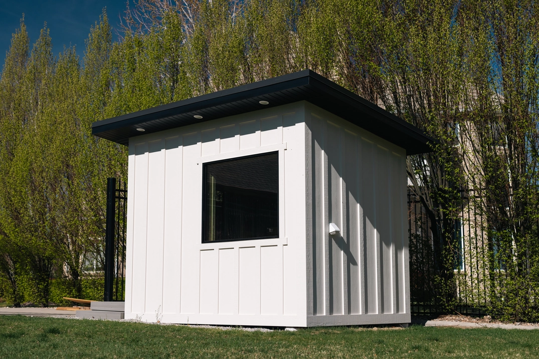 Rear exterior of the white Custom Lehi outdoor sauna