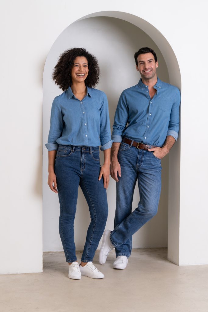 group shot of male and female model wearing denim long sleeve shirt with AS colour jeans