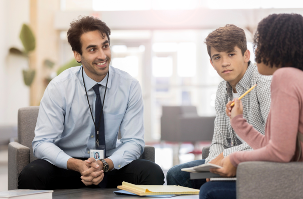 Teacher talking to students