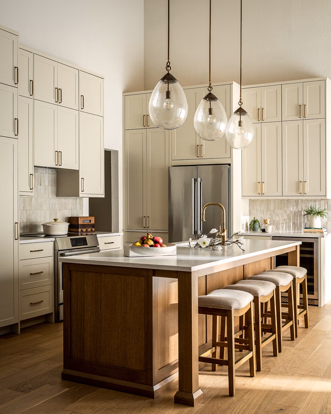 Remodeled kitchen with custom cabinetry and a warm wood island in a Westlake, Austin home