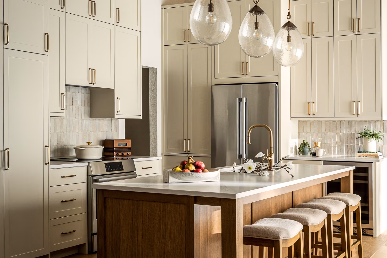 Remodeled kitchen with custom cabinetry and a warm wood island in a Westlake, Austin home