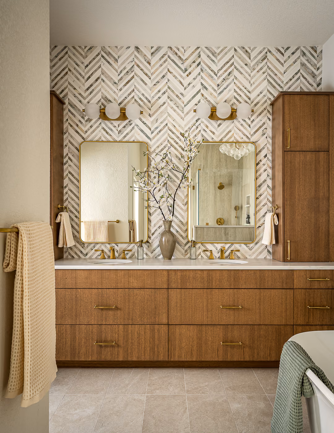 Custom wood bathroom vanity with dual mirrors and a patterned tile backsplash