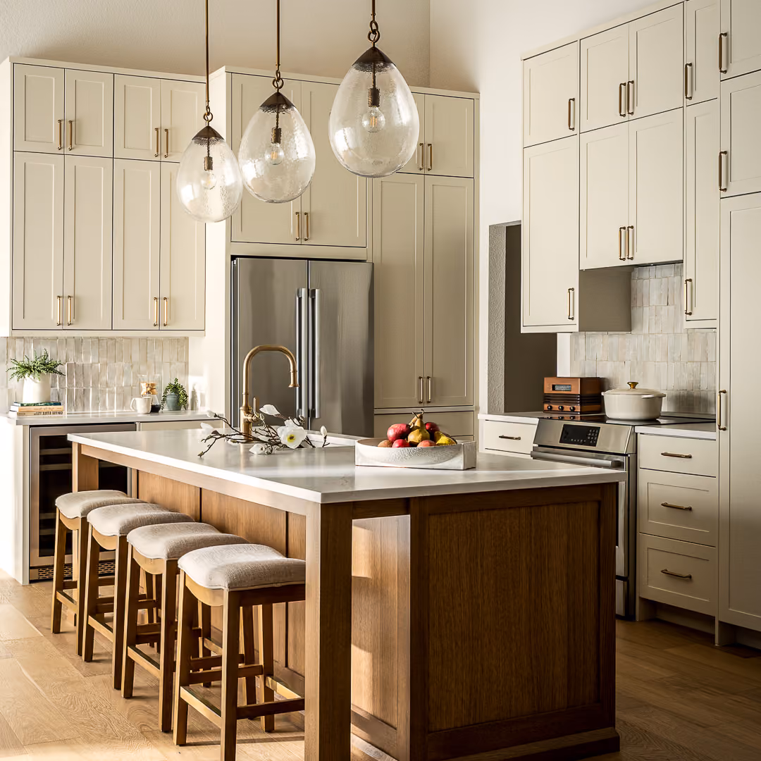Westlake kitchen remodel with a large wood island, seating, and light perimeter cabinets