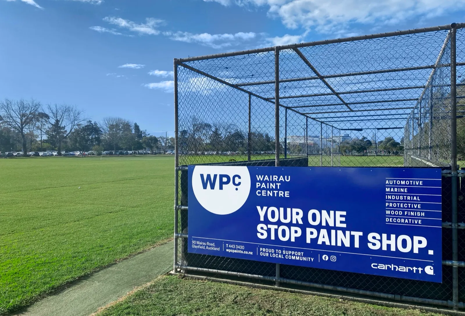 Wairau Paint Centre banner on the cricket nets at Takapuna District Cricket Club