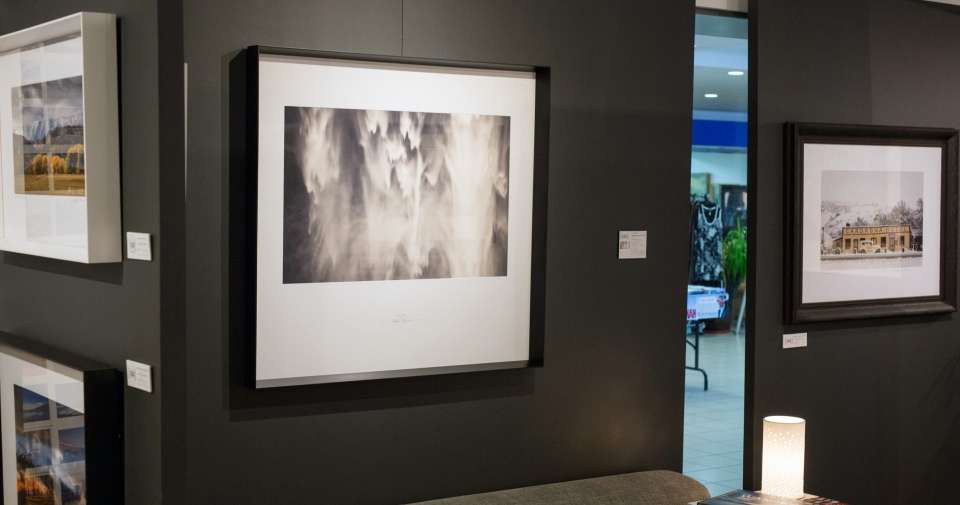 Photos hanging on wall from the Picture Lounge in Wanaka.