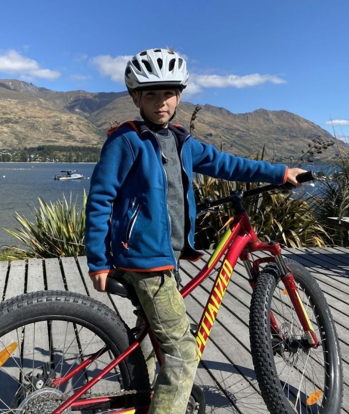 Child on bike exploring Wanaka.