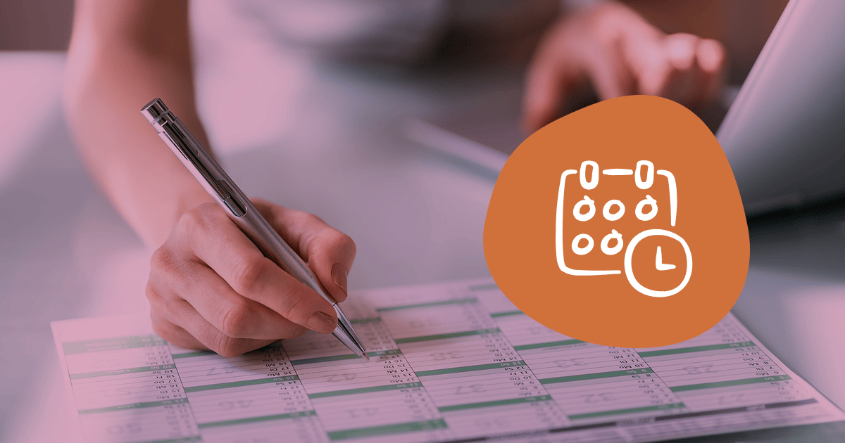 Hand writing in a paper planner, with a calendar-and-clock icon overlaid