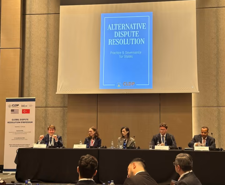 Dr. Emad Hussein participating in a panel discussion at the Global Dispute Resolution Symposium on alternative dispute resolution.