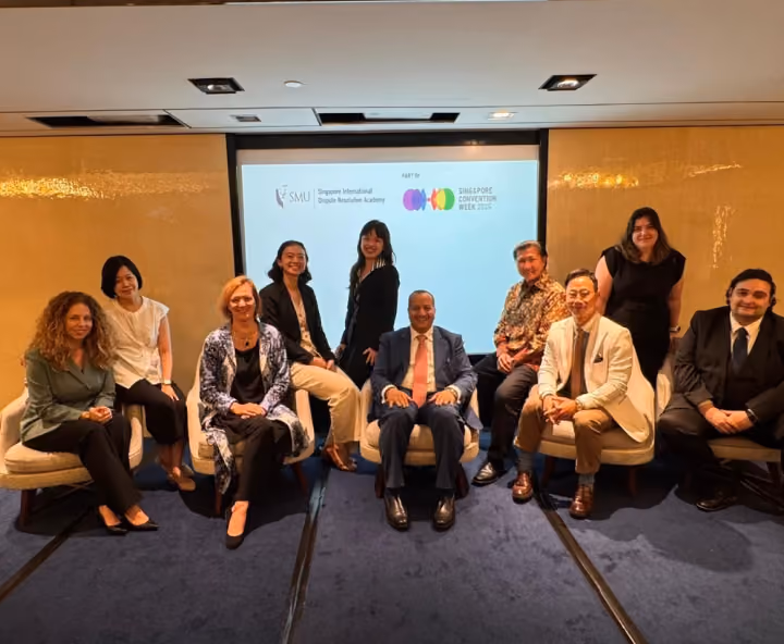 Dr. Emad Hussein with international dispute resolution professionals at a Singapore International Dispute Resolution Academy event.