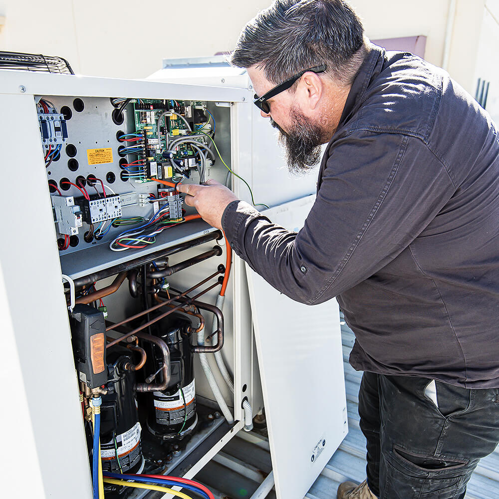 Repair work in electrical system on commercial roof