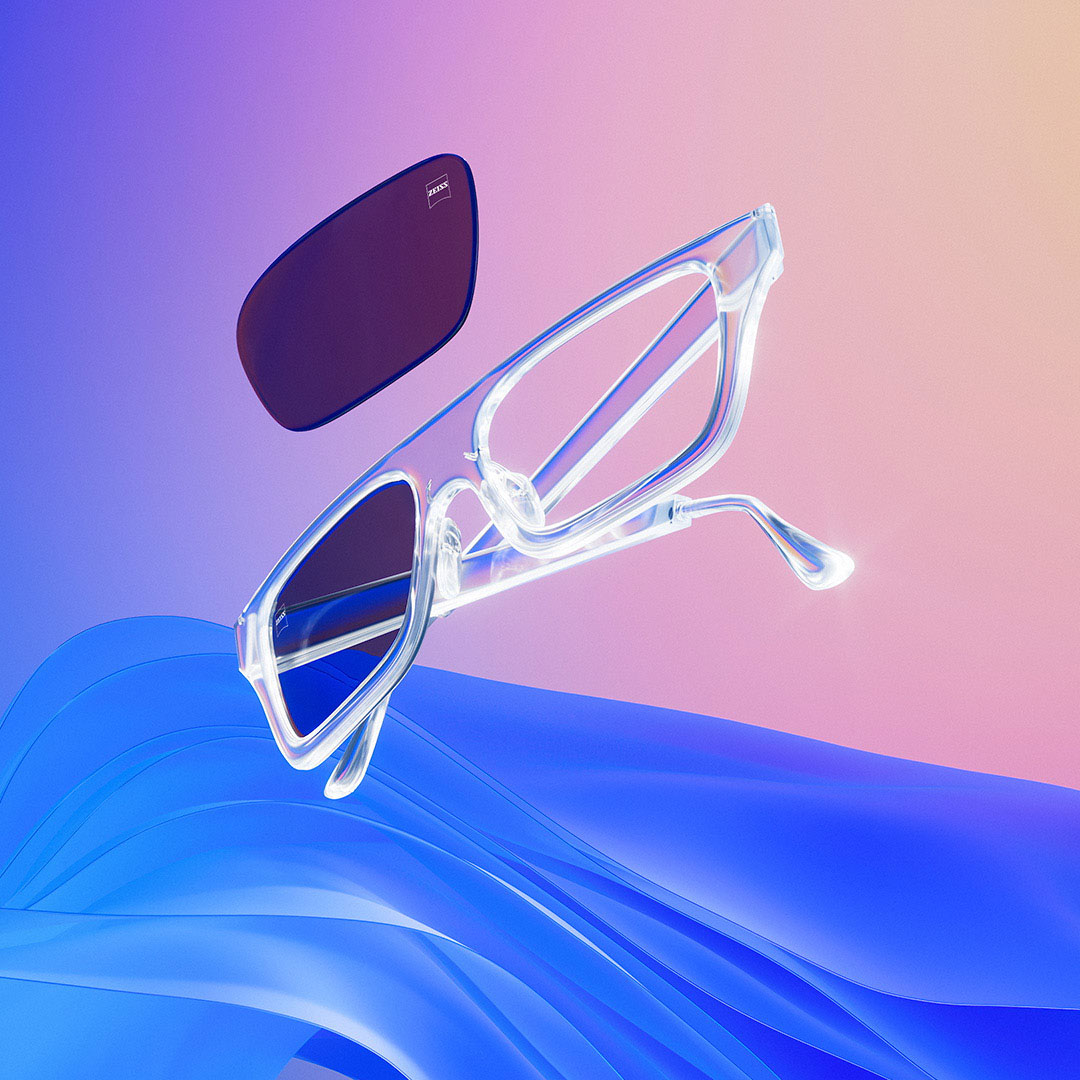 A stylised image of a pair of glasses with ZEISS lenses. One of the lenses is being inserted into the frame.