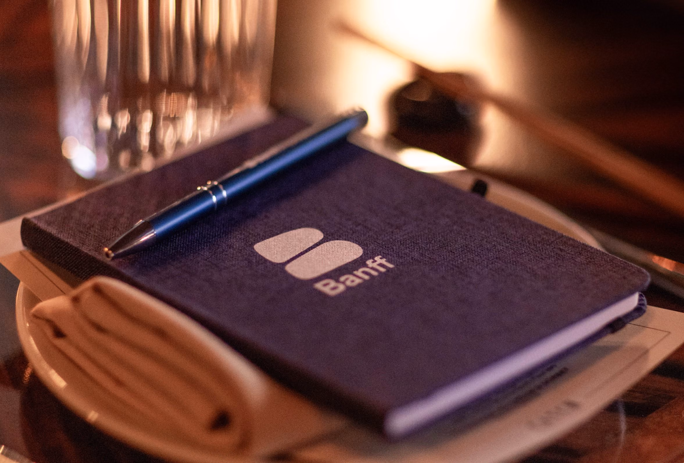 Notebook and pen on an executive's desk