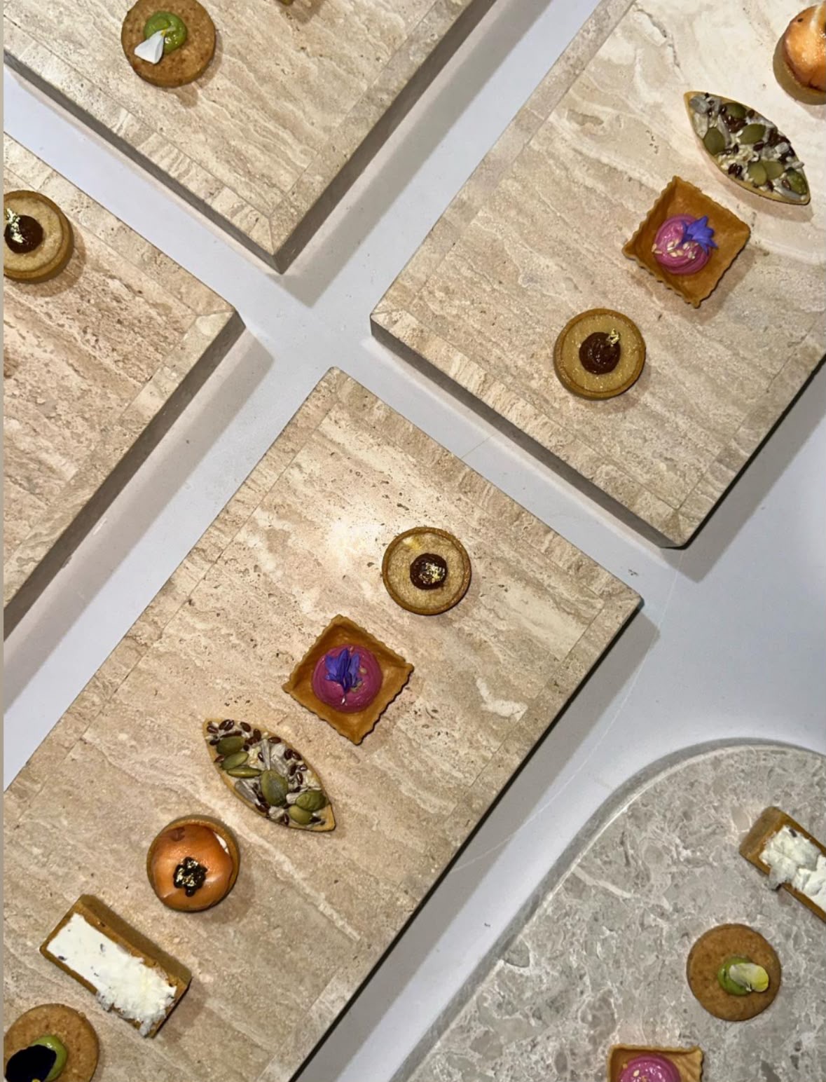 Marble trays of canapés prepared ahead of an event