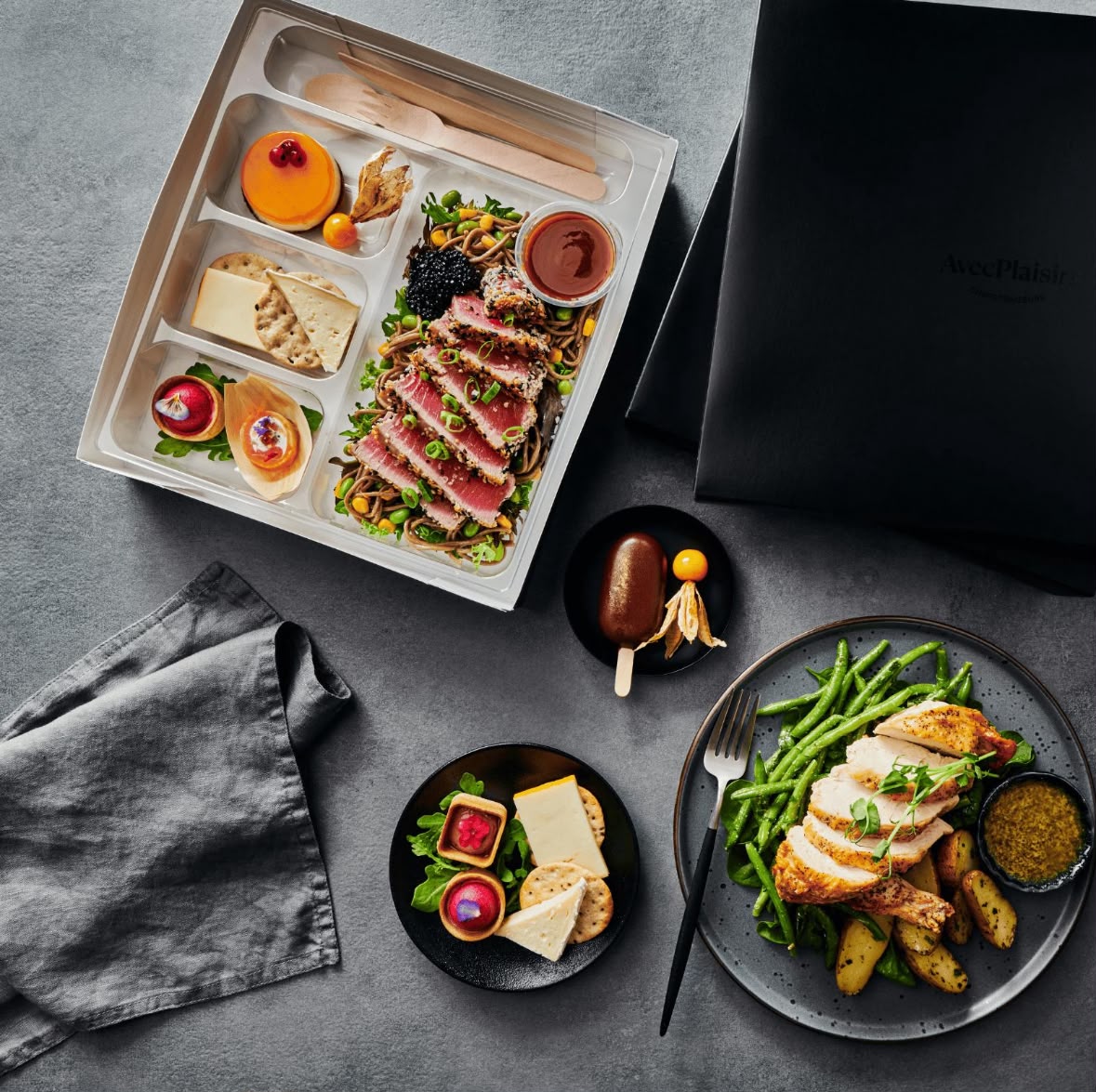 An overhead spread of small bites styled with flowers