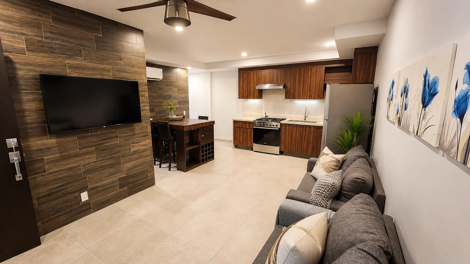 Sample residence living room and kitchen at Quince Sur
