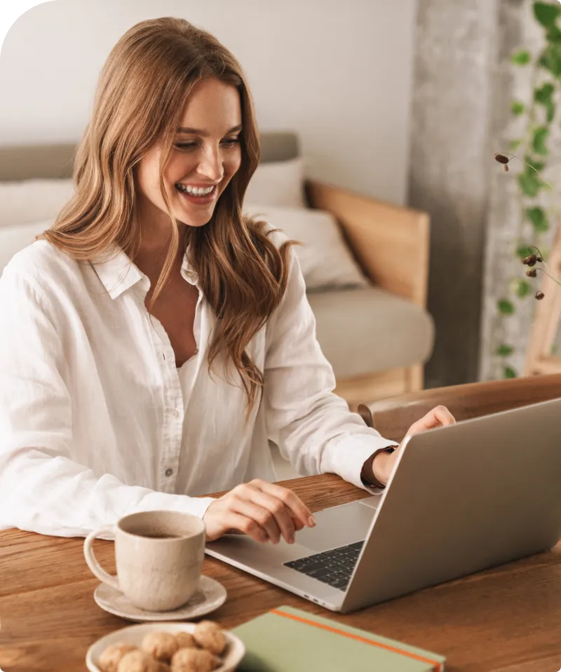 A smiling lady using laptop