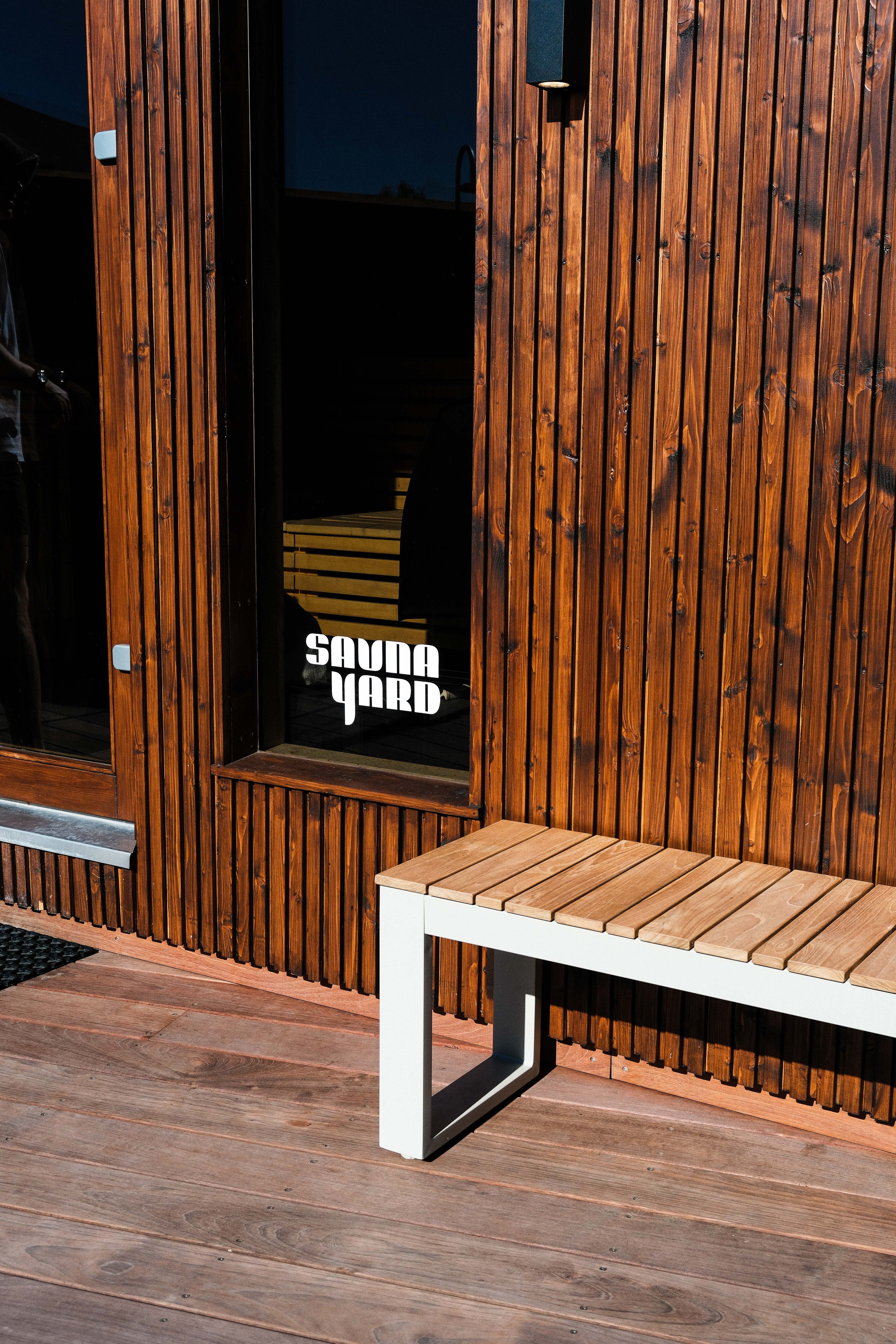 A bench in front of our hot sauna
