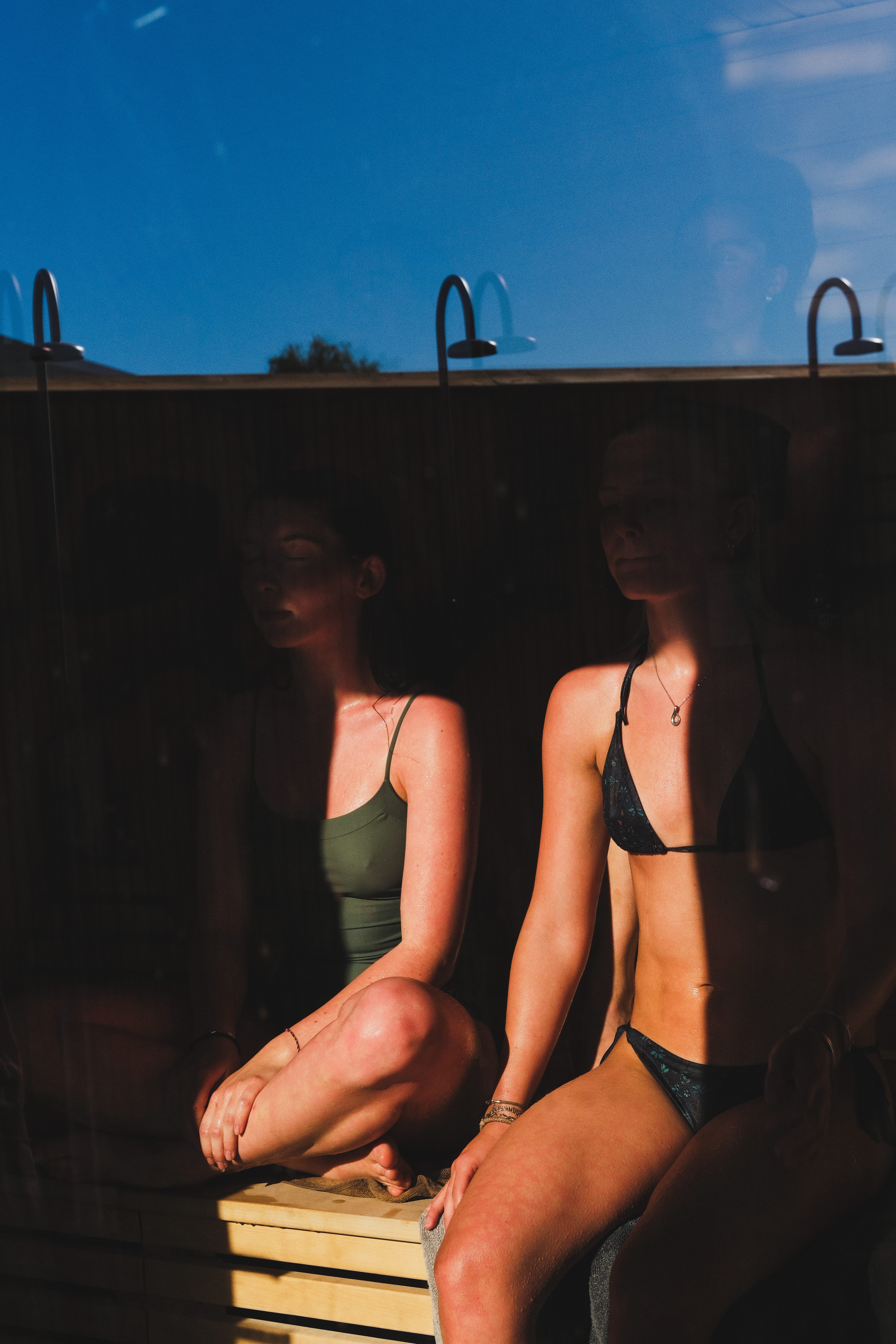 Guests sit relaxed in the sauna