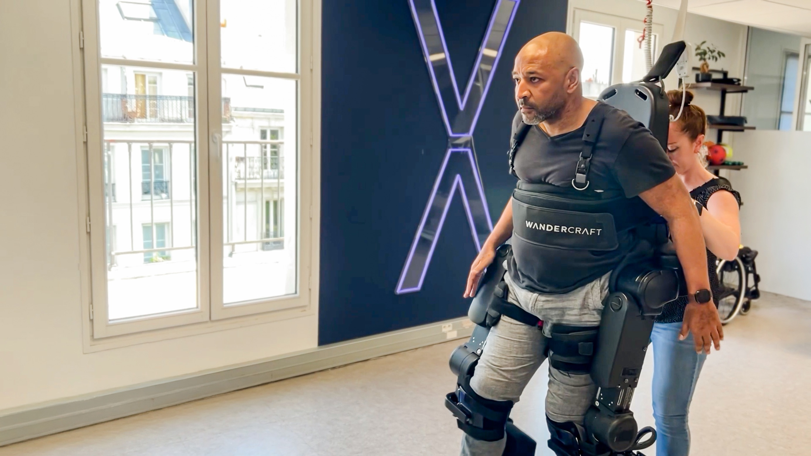 Patient walking with Atalante X during a therapy session