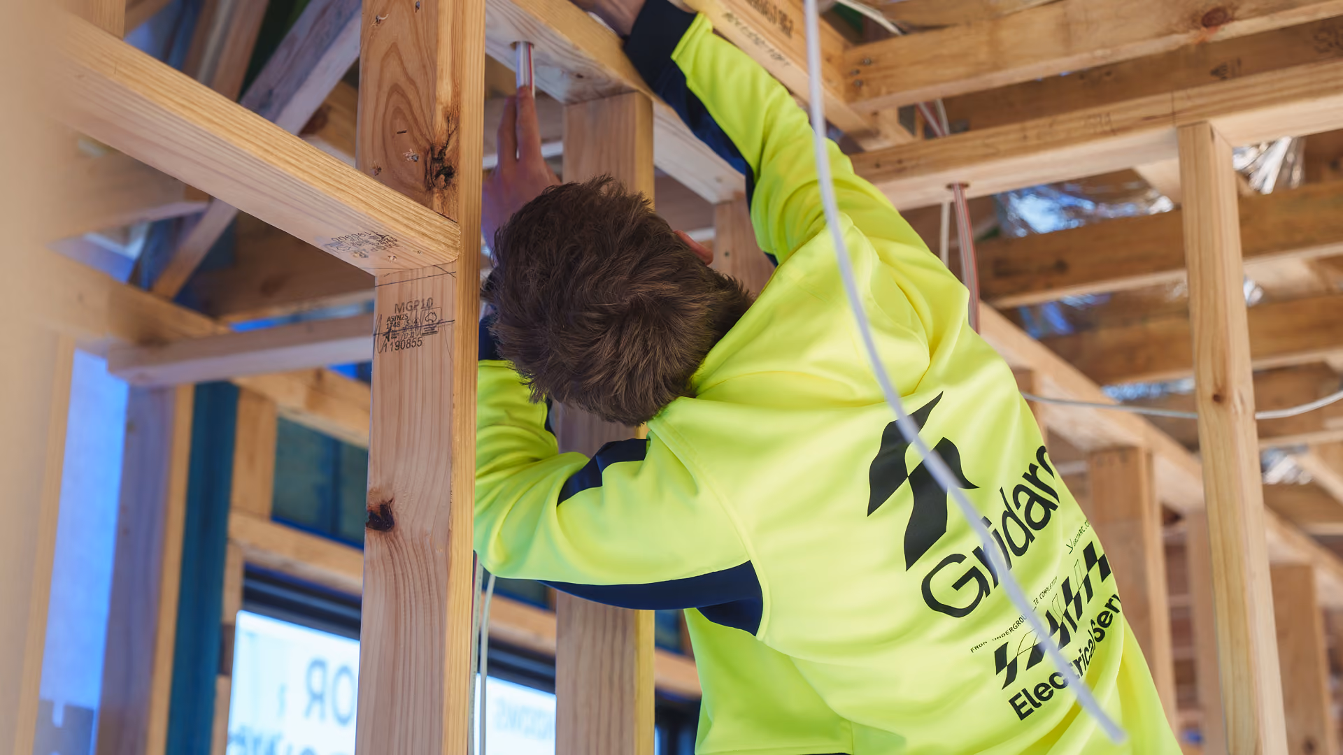 Electrician working on site with wiring