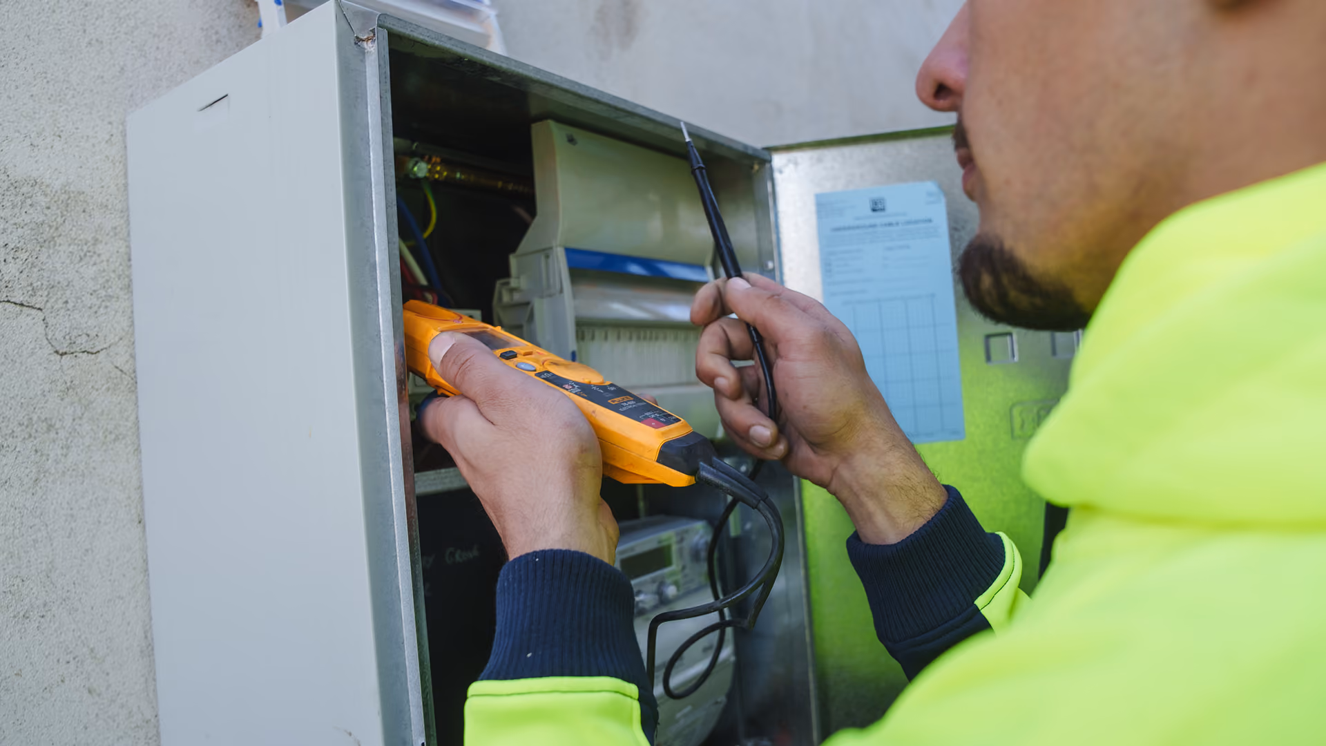 Electrician testing power supply