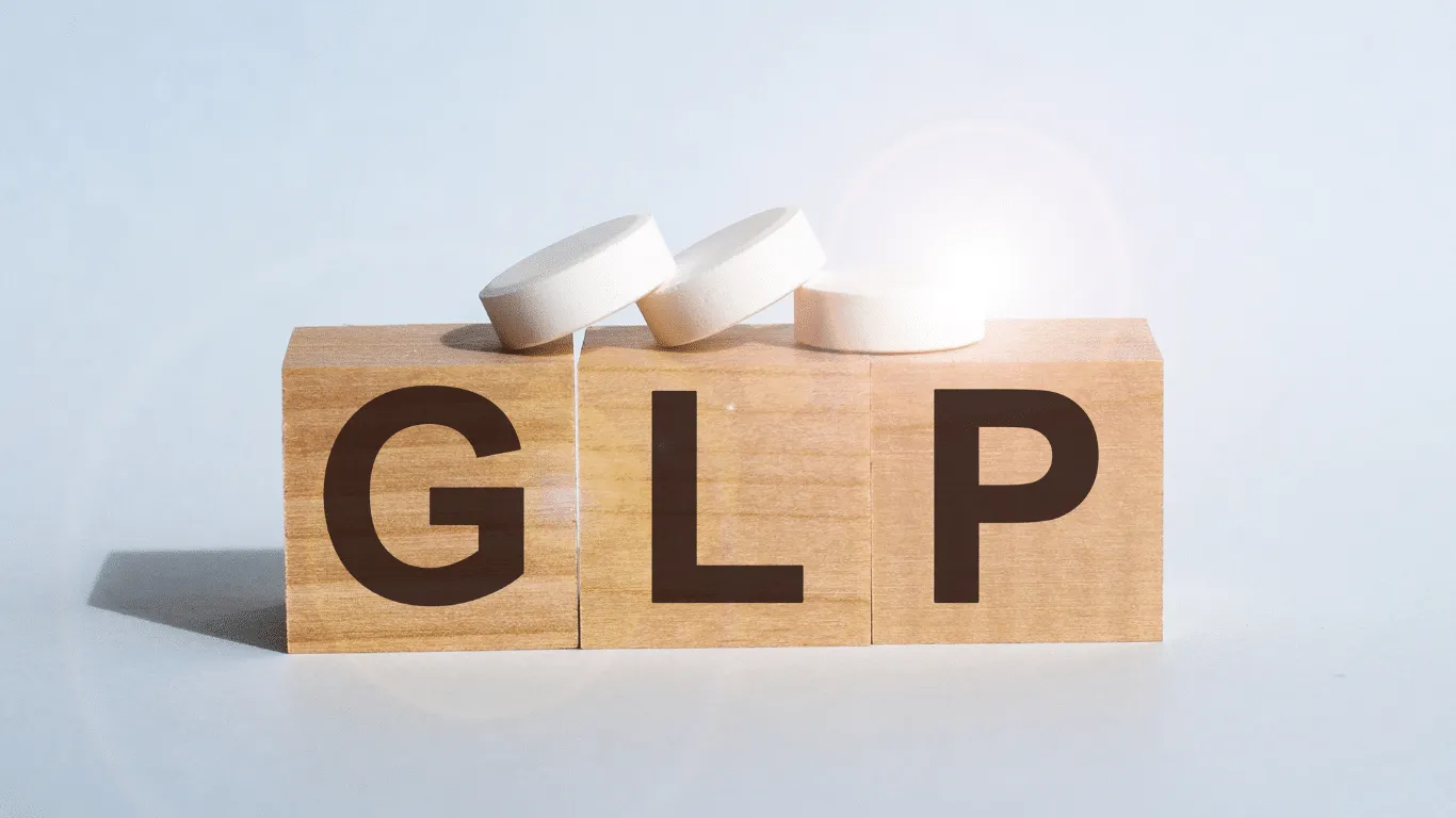 Wooden blocks displaying the letter