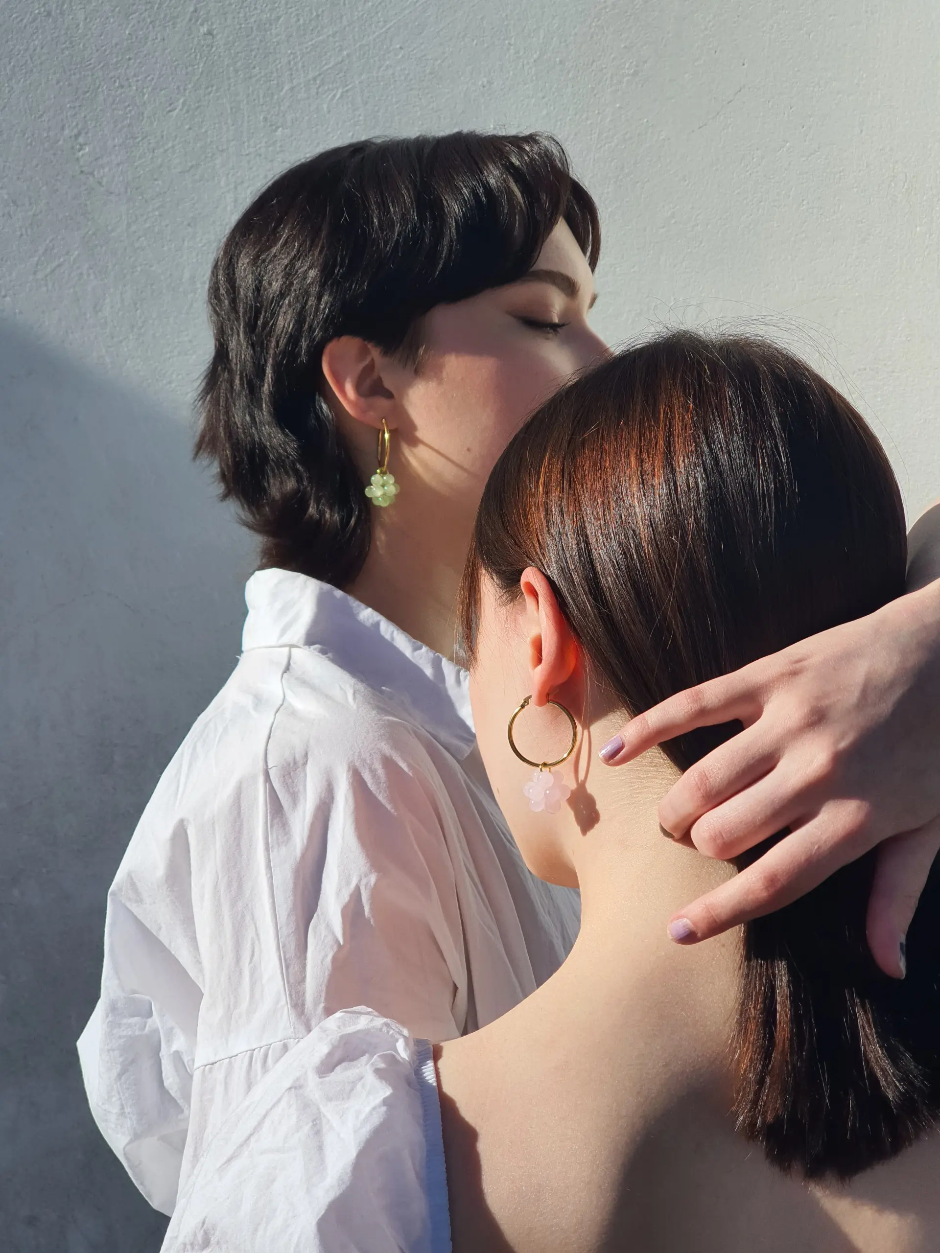 An image of two models showcasing Paula Korut visual identity by Karamell