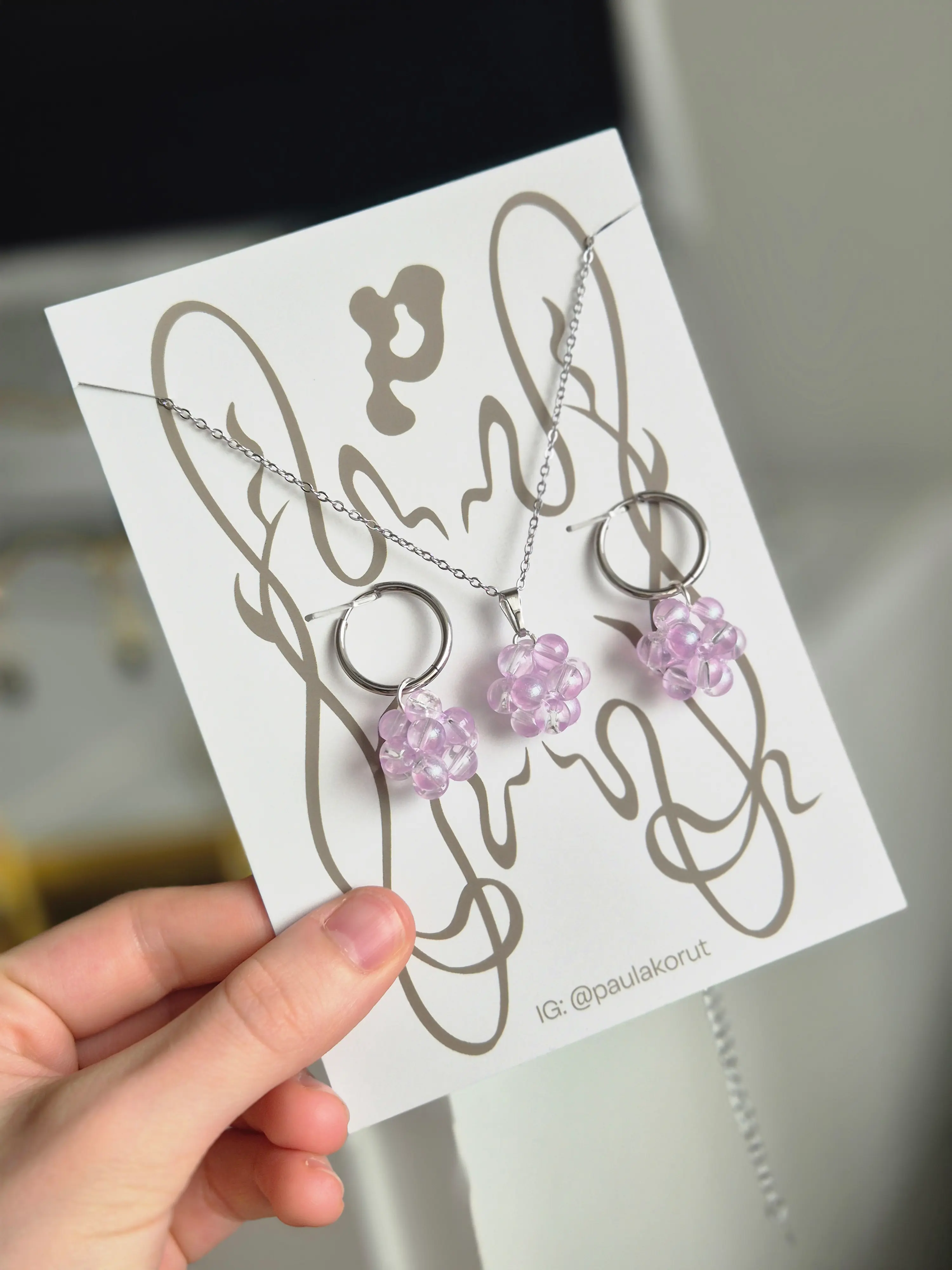 Paula Korut jewelry attached to package design by Karamell