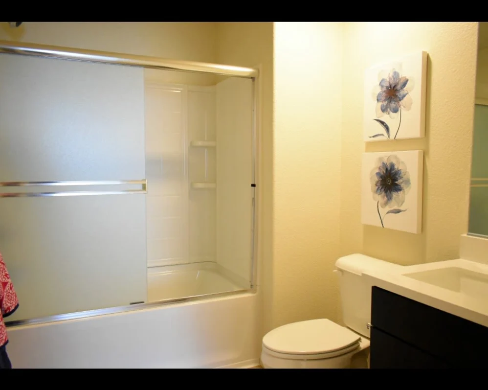 Bathroom with dark cabinets 