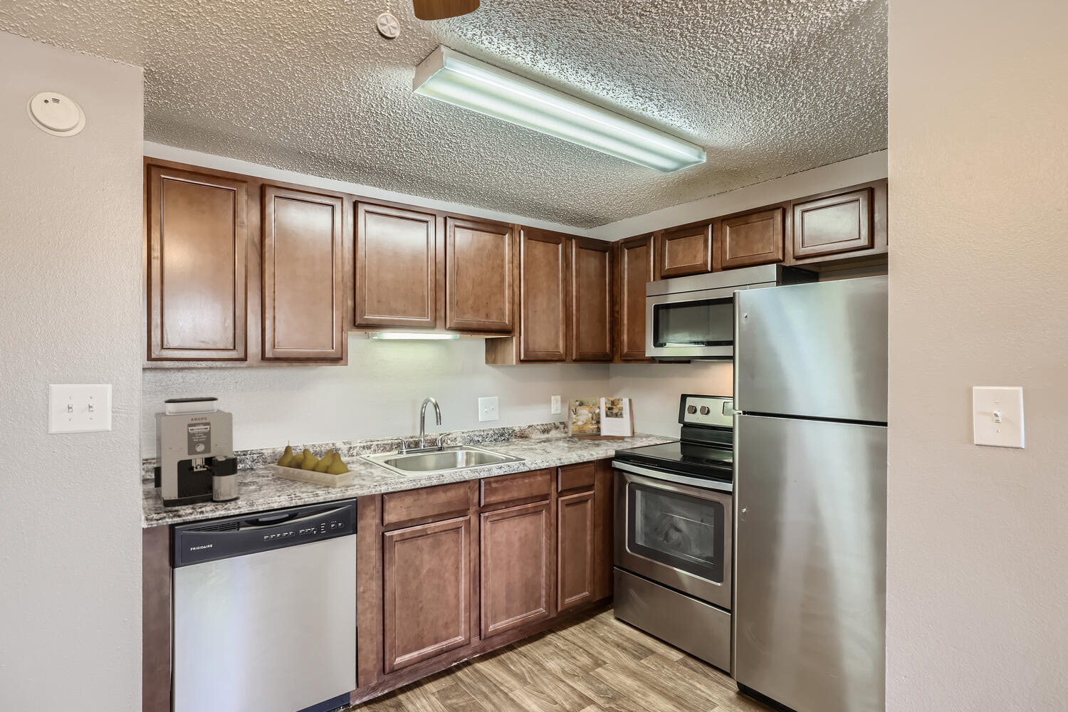 Kitchen with brown cabinets