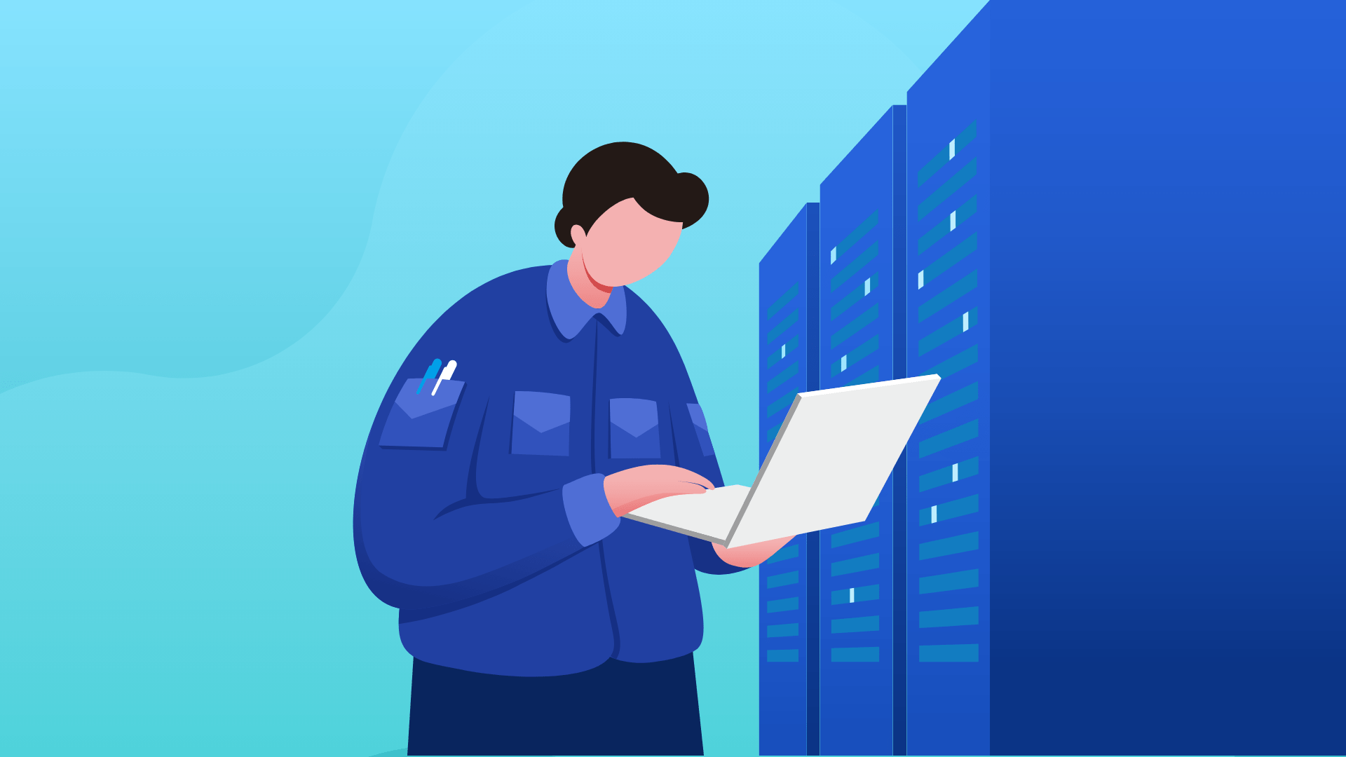 A specialist with a laptop in a data center.