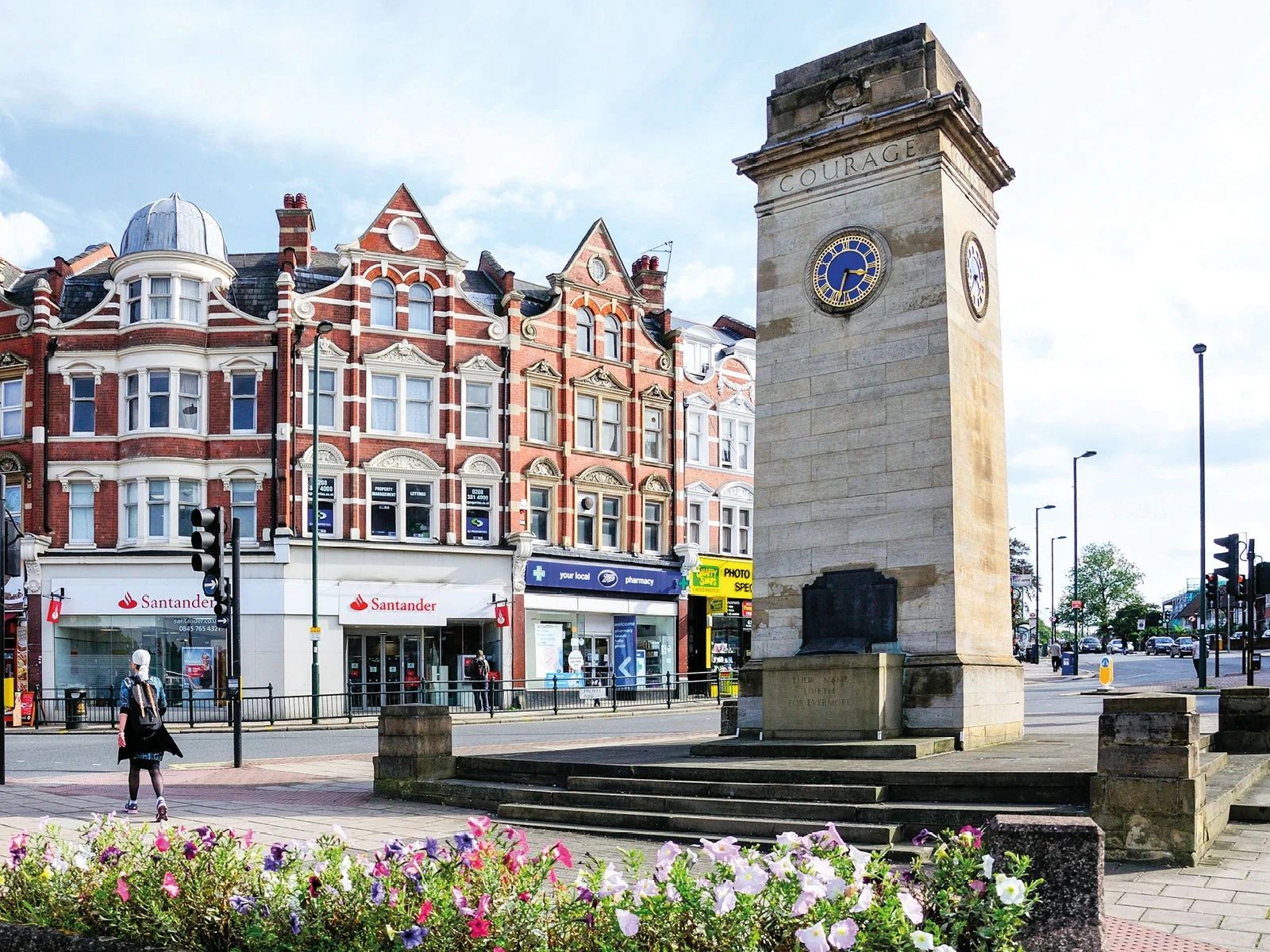 Clock tower war memorial and shops in Barnet
