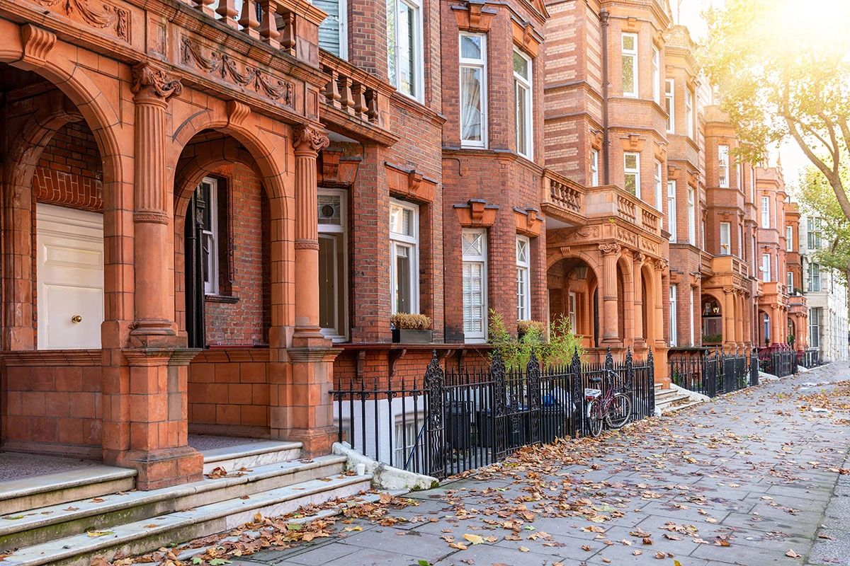 Red brick mansion blocks on a Kensington and Chelsea street