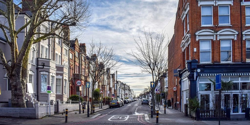 Terraced houses and shops on a residential street in south London