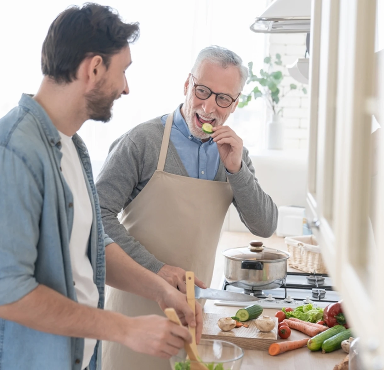 Family members preparing and tasting a healthy meal together