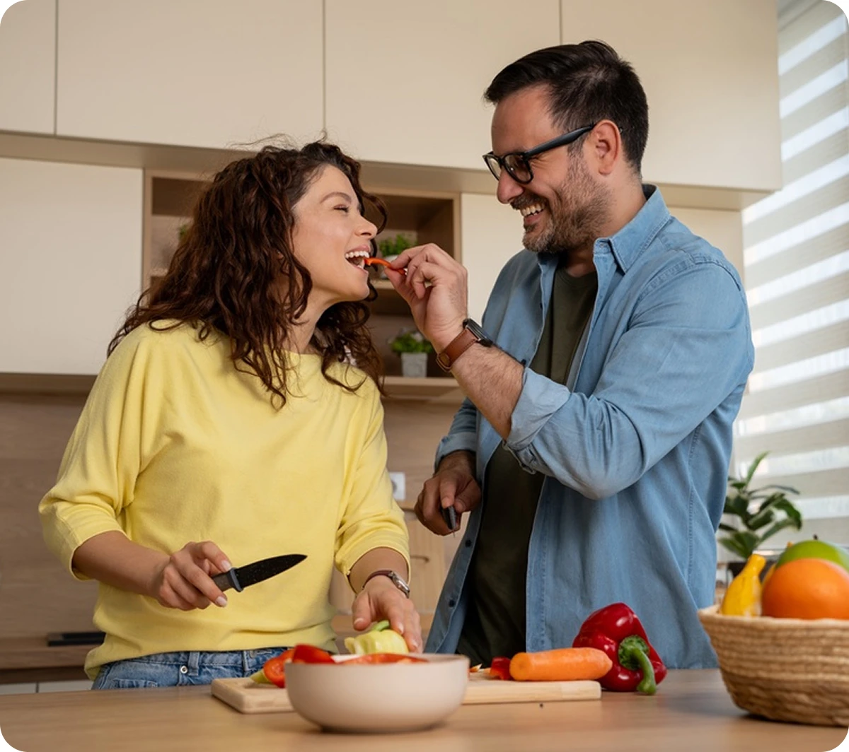 Couple cooking together and building healthy eating habits