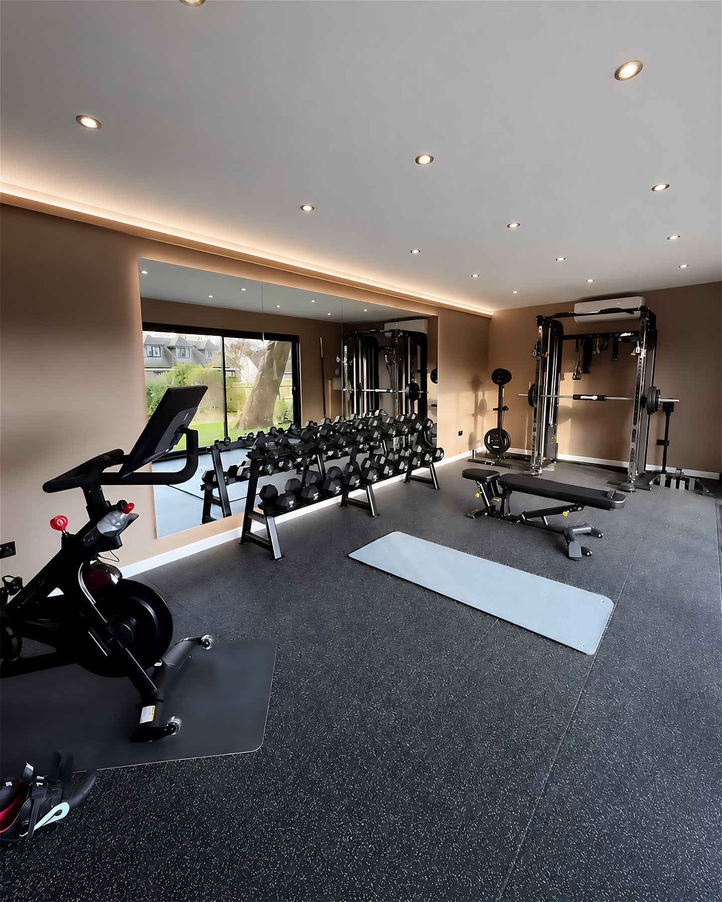 Premium residential home gym with strength, cardio and free-weight equipment