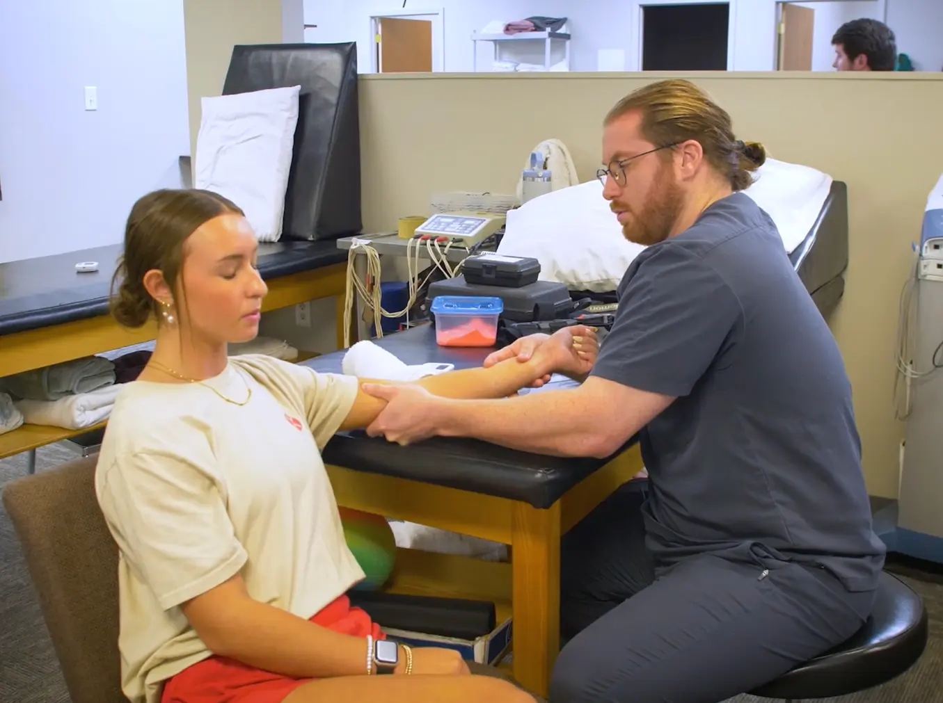 Darby performing a myofascial release on a patient's heel