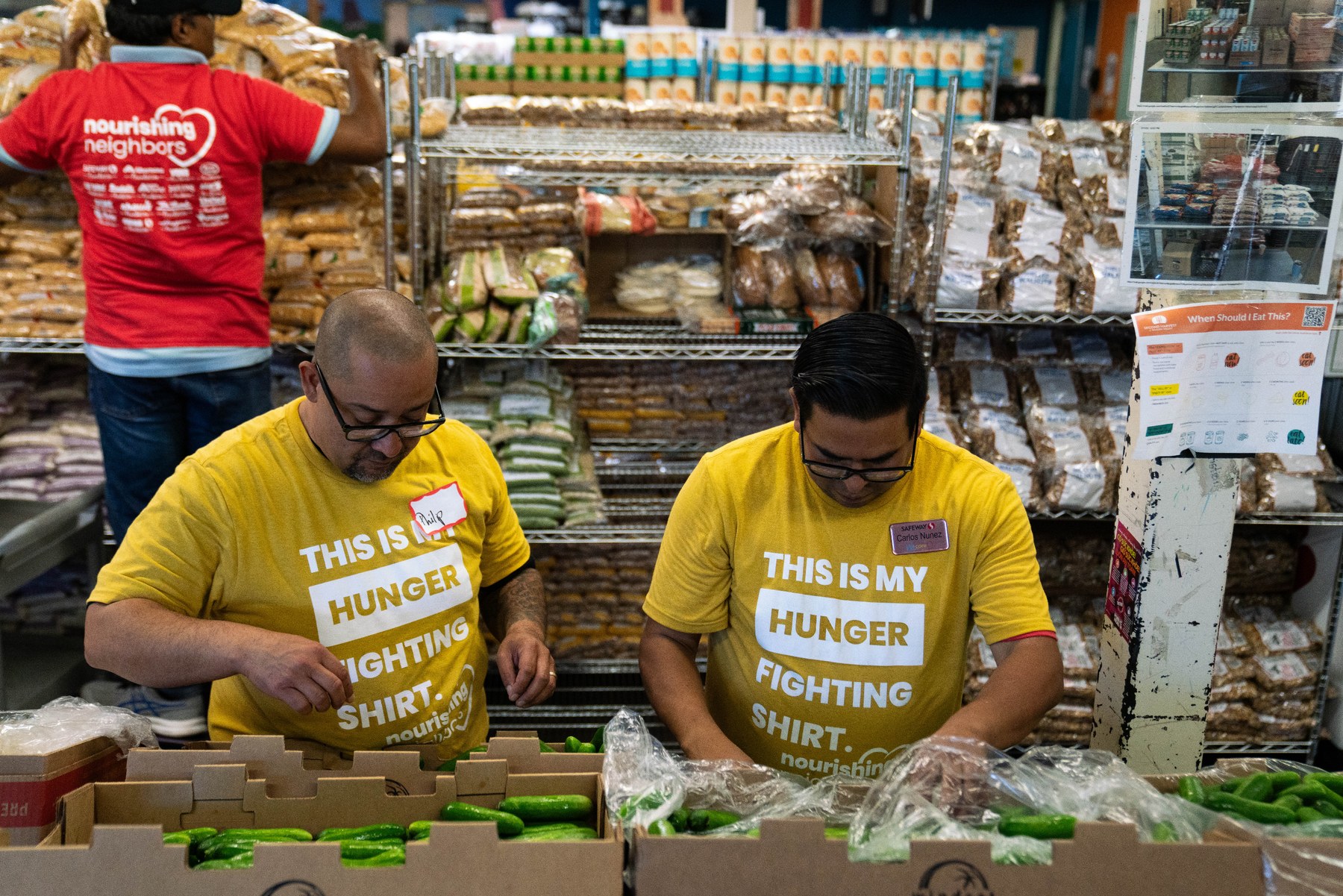 Volunteers pack fresh produce for their community