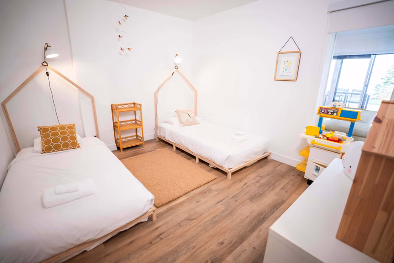Chambre 2 du condo 106 avec lits simples, Aurea Charlevoix