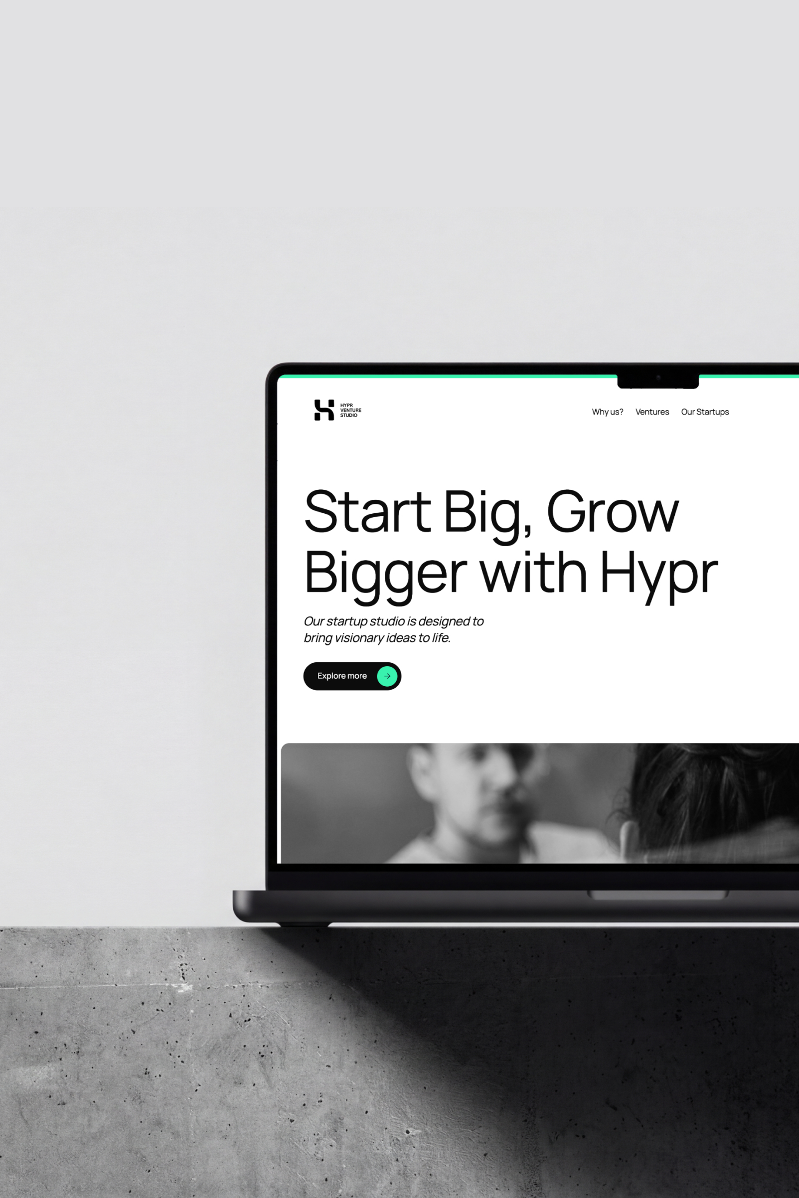 Laptop displaying a website homepage with headline 'Start Big, Grow Bigger with Hypr' and a button labeled 'Explore more'.