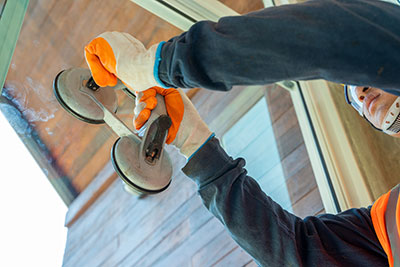 Glass replacement technician putting glass into a frame