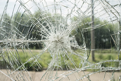 A spider web crack in window glass