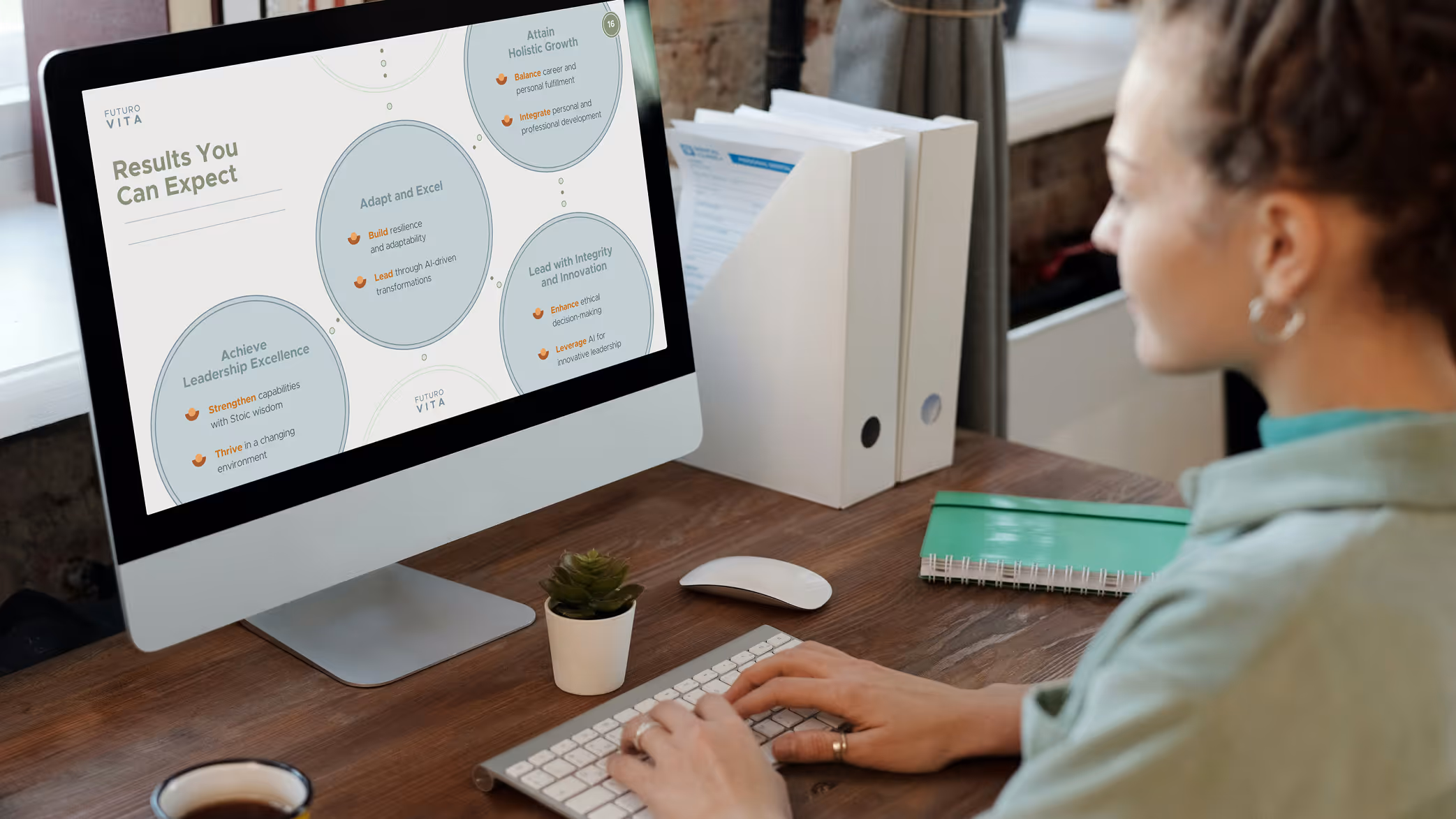 Person typing on a keyboard at a desk with a monitor displaying a presentation titled 'Results You Can Expect' by Futuro Vita.